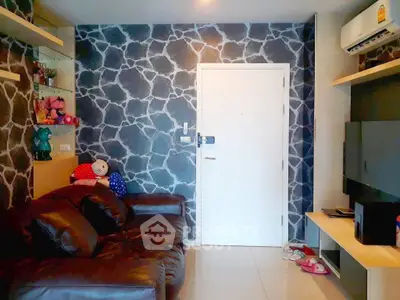 Stylish living room with unique stone-patterned accent wall and modern furnishings.