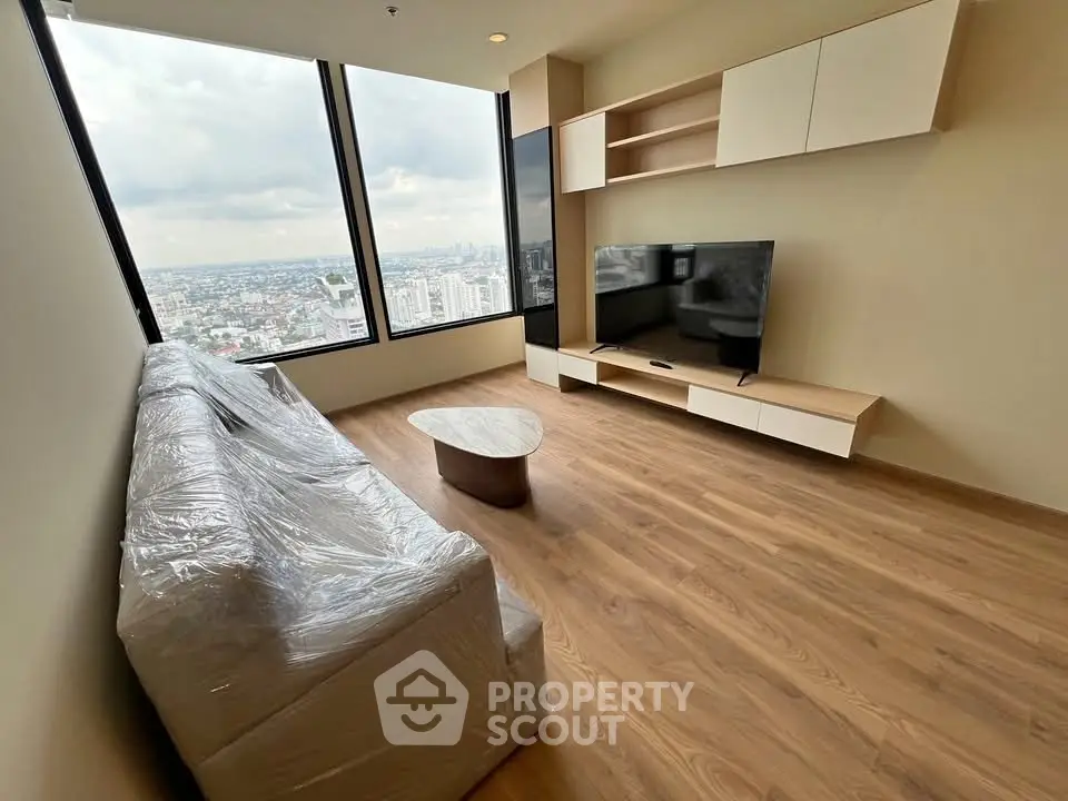Modern living room with panoramic city view and sleek furnishings