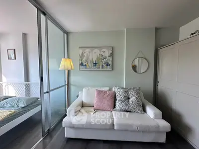 Chic living room with modern decor and cozy sofa in stylish apartment.
