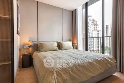Modern bedroom with large windows and city view in luxury apartment