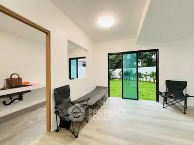 Modern living room with garden view and sliding glass doors