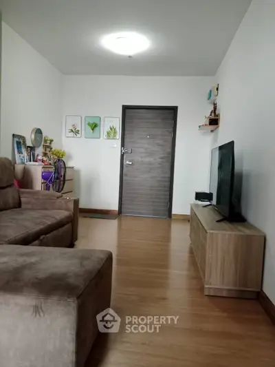 Cozy living room with modern decor and wooden flooring