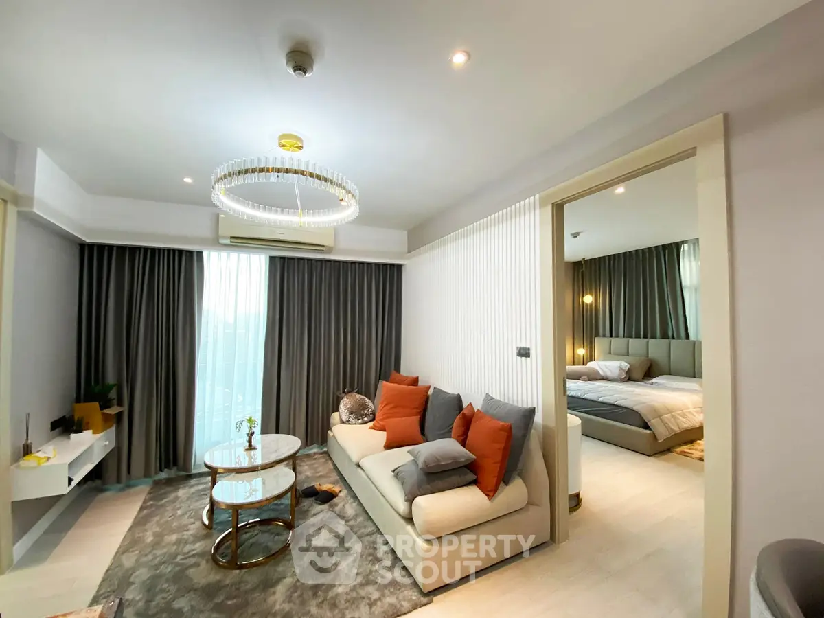 Modern living room with elegant decor and cozy bedroom view in luxury apartment