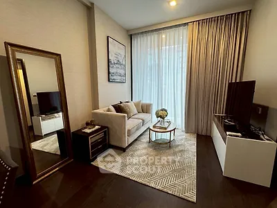 Elegant living room with modern decor and large window, featuring a cozy sofa and stylish TV unit.