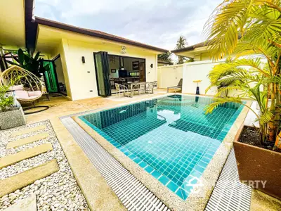 Luxurious private villa with stunning pool and modern outdoor seating area