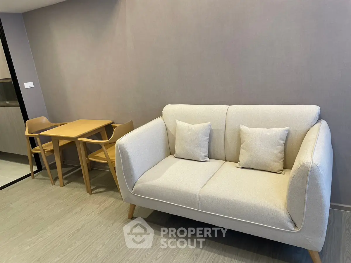 Modern living room with cozy sofa and dining table in a stylish apartment