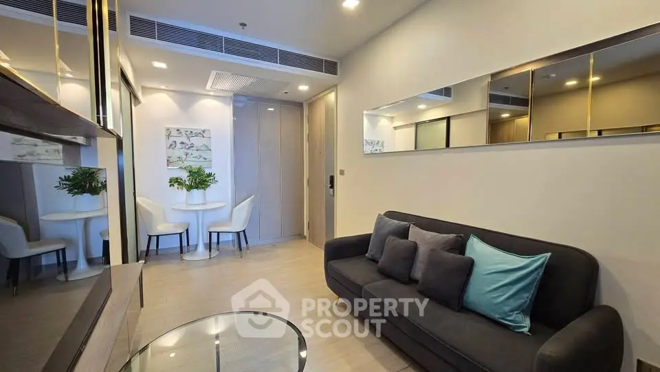 Modern living room with stylish decor and cozy seating in a contemporary apartment.