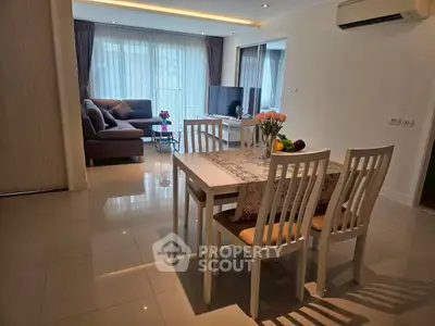 Spacious living room with elegant dining area and modern decor