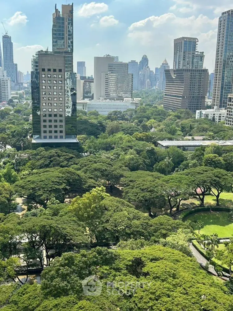 Stunning cityscape view with lush green park and modern skyscrapers.