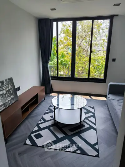 Modern living room with large windows and stylish decor