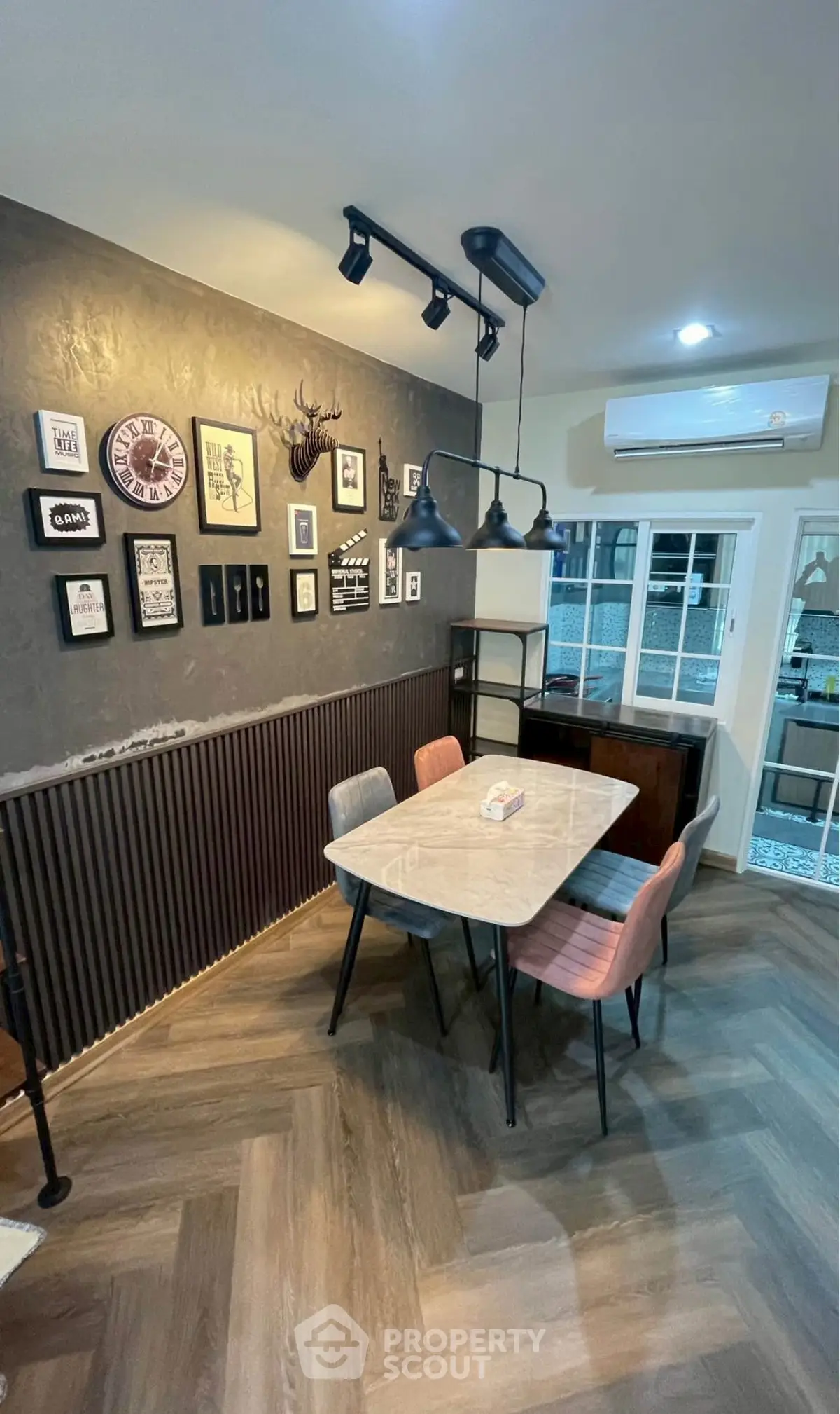 Stylish dining area with modern decor and elegant lighting in a cozy home setting.