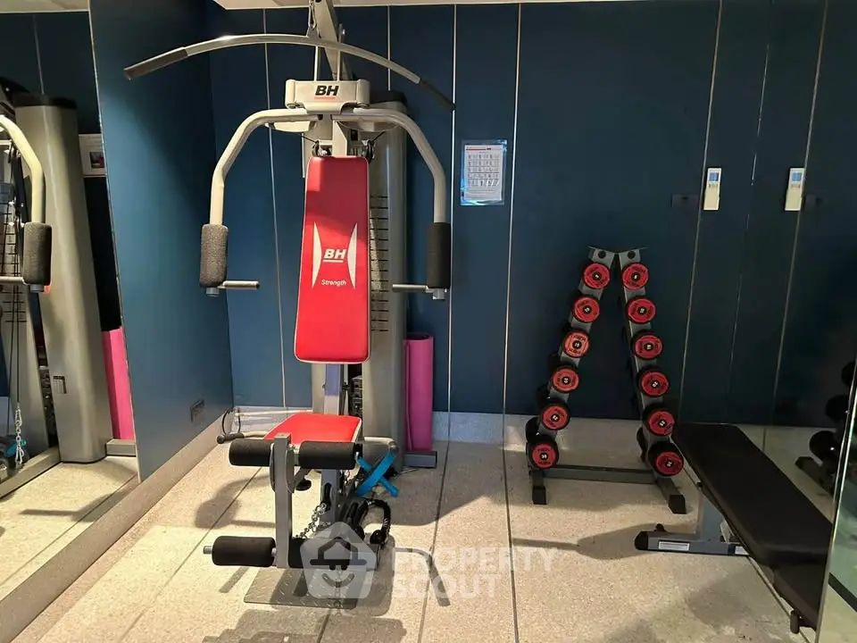 Modern gym with fitness equipment in a residential building