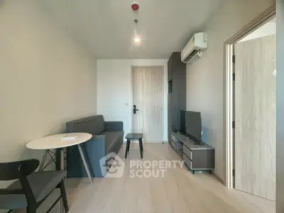 Modern living room with minimalist furniture and air conditioning