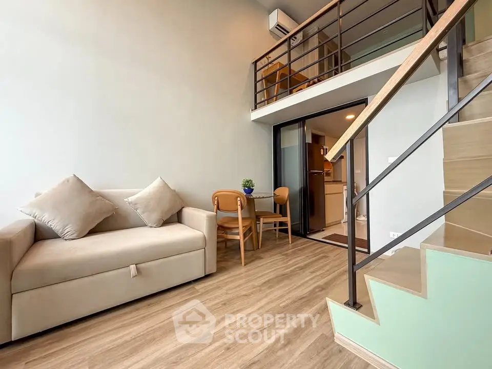 Modern loft apartment with stylish mezzanine and cozy living area, perfect for urban living.