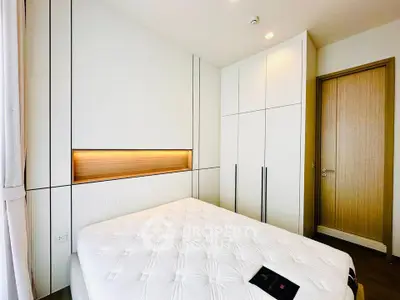 Modern bedroom with sleek built-in wardrobe and cozy lighting
