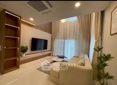 Luxurious modern living room with high ceilings and elegant decor