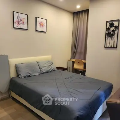 Cozy bedroom with modern decor and comfortable bed in stylish apartment.