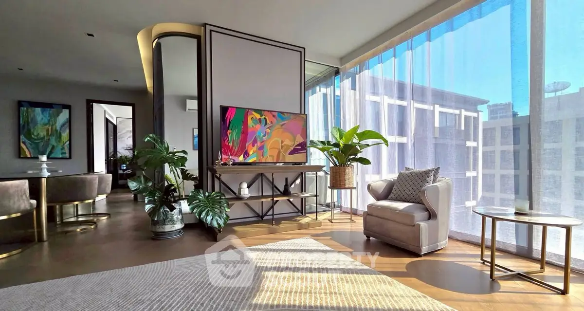Luxurious modern living room with large windows and stylish decor in a high-end apartment.
