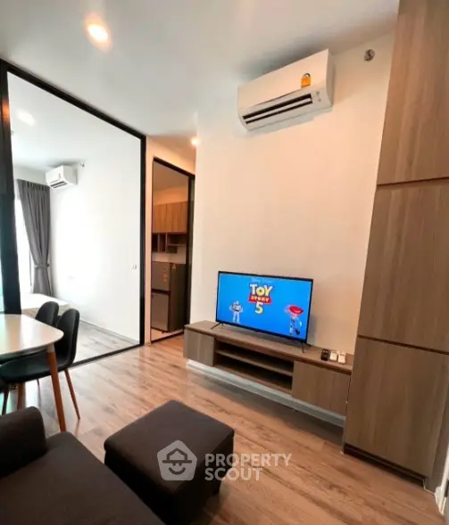 Modern living room with air conditioning and stylish furniture in a contemporary apartment.