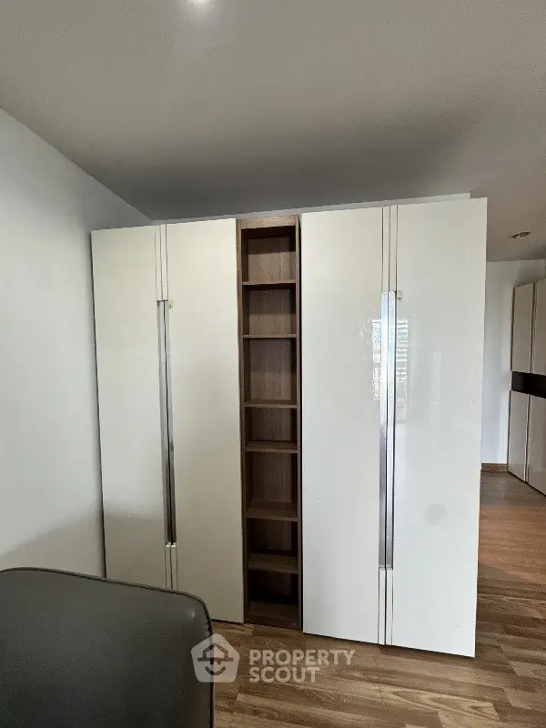 Modern wardrobe with sleek design and ample storage space in a stylish interior.