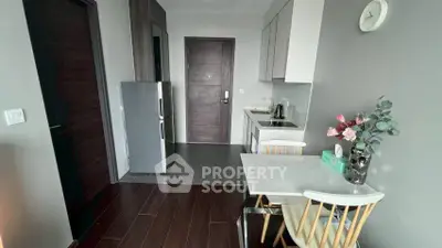 Modern kitchen with sleek design and compact dining area