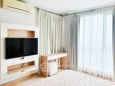 Bright and airy bedroom with modern furnishings and large window