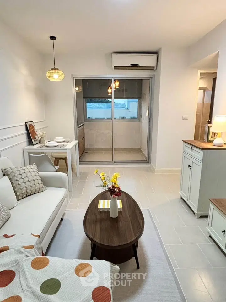 Modern living room with cozy decor and open kitchen layout