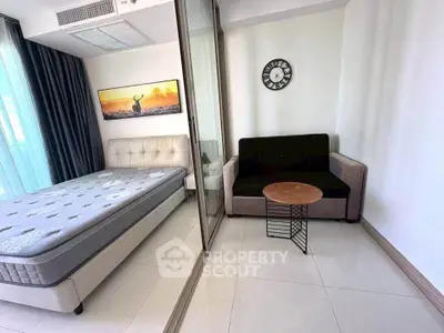 Modern bedroom with stylish decor and comfortable furnishings in a bright apartment.
