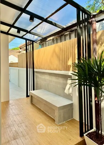 Stylish outdoor patio with modern design and wooden flooring, perfect for relaxation and entertaining.