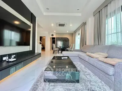Luxurious modern living room with elegant decor and spacious seating area.