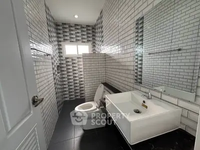 Modern bathroom with stylish tile design and sleek fixtures