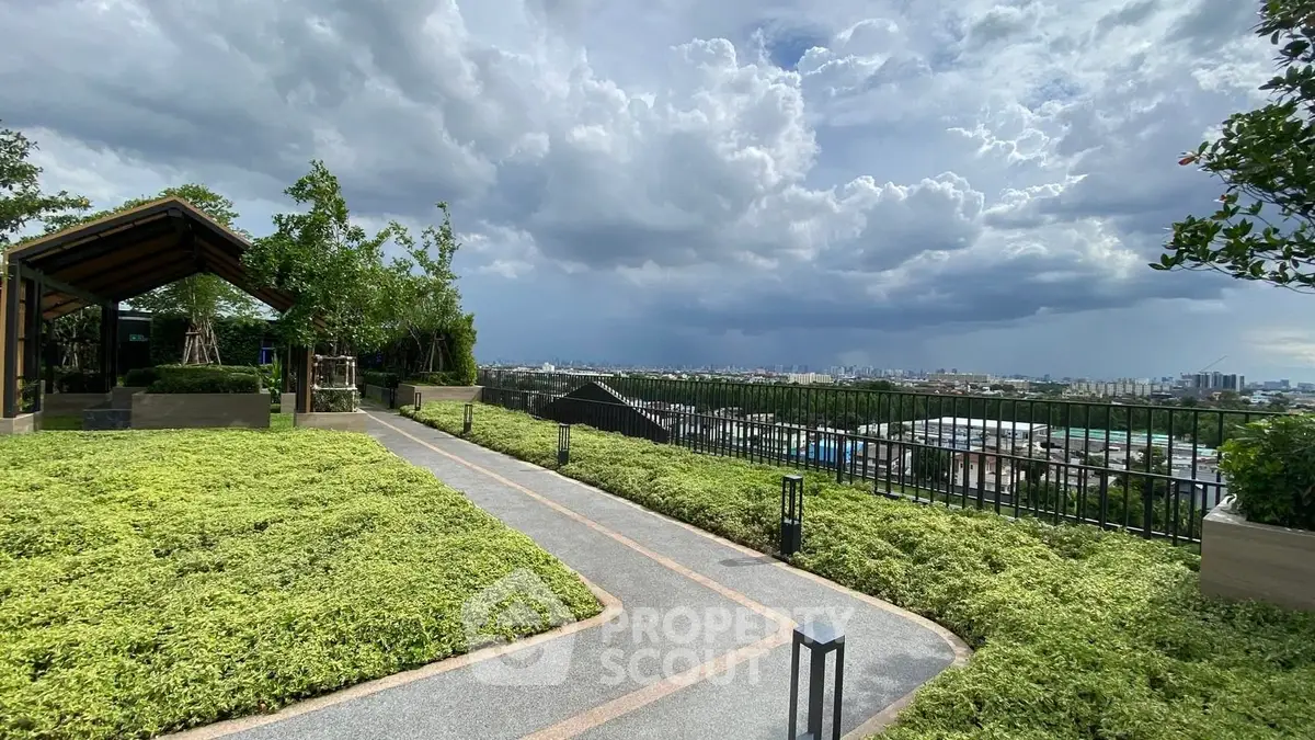 Stunning rooftop garden with panoramic city views and lush greenery.