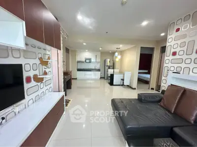Spacious modern living room with open kitchen and stylish decor
