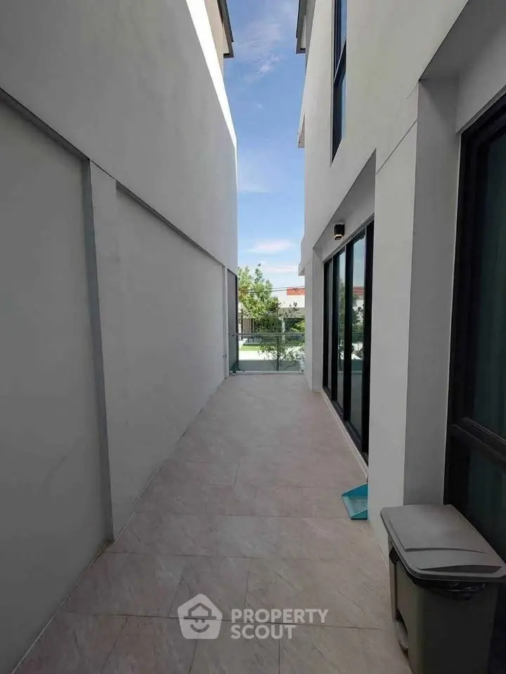 Modern exterior corridor with sleek design and natural light