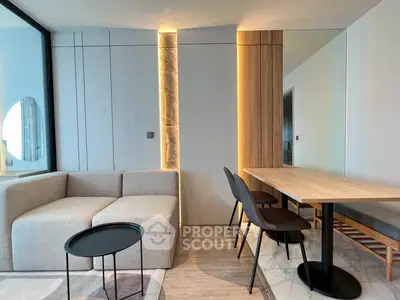 Modern living room with stylish furniture and elegant lighting in a contemporary apartment.