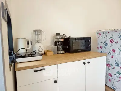 Charming kitchen corner with modern appliances and stylish cabinetry