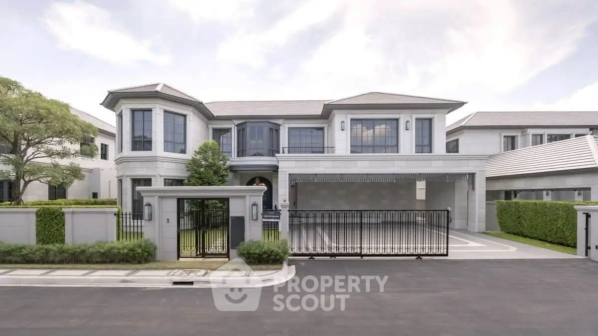 Luxurious modern mansion with elegant facade and spacious driveway in upscale neighborhood.