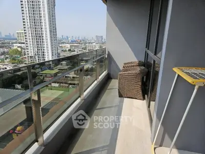 Spacious balcony with city view in modern high-rise apartment