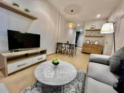 Modern living room with stylish decor and open dining area, featuring a cozy ambiance and contemporary furniture.