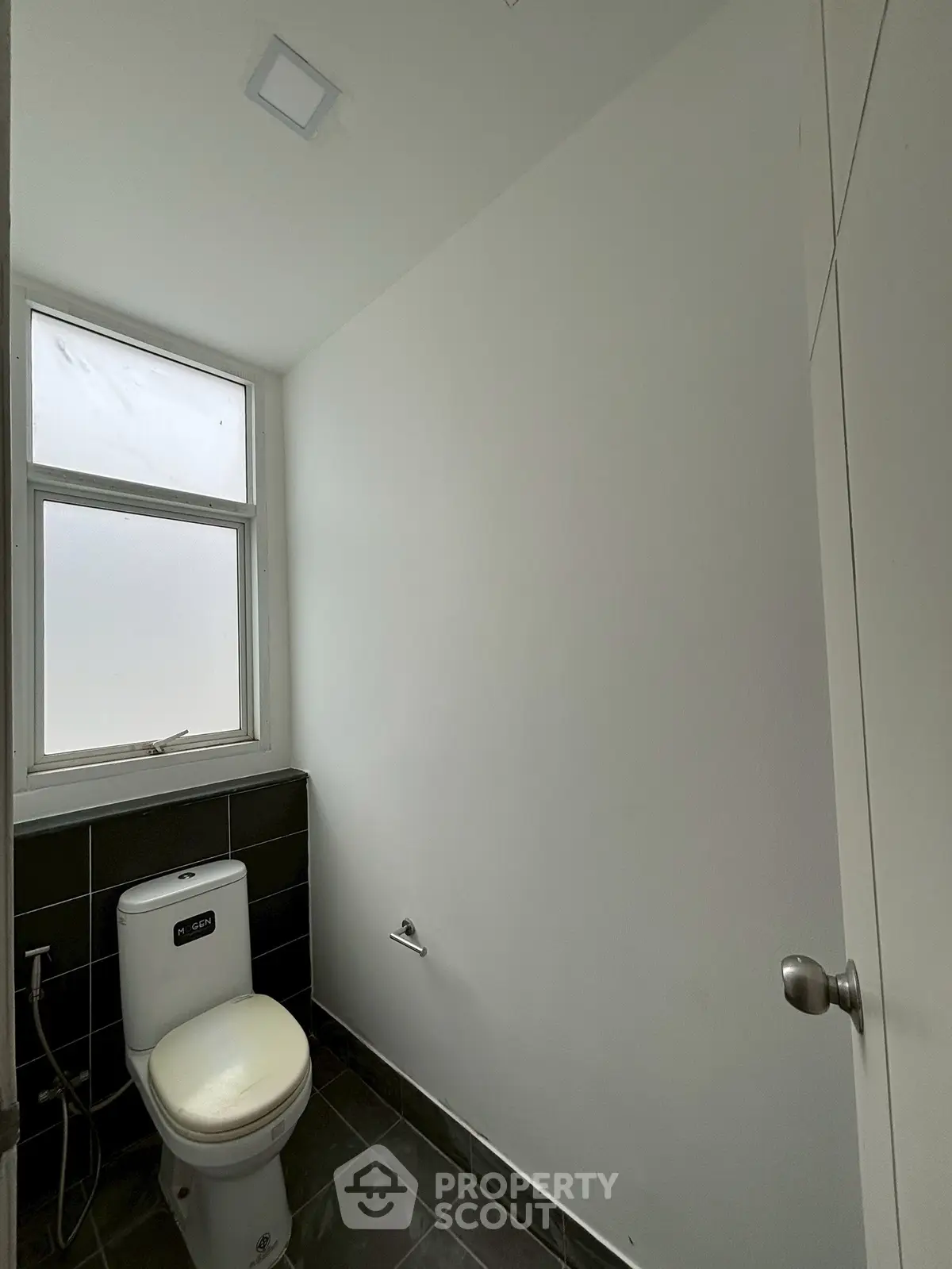 Minimalist bathroom with modern fixtures and natural light
