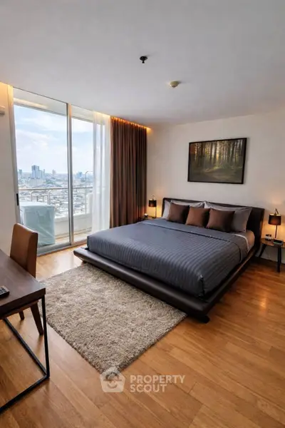Luxurious bedroom with stunning city view and modern decor