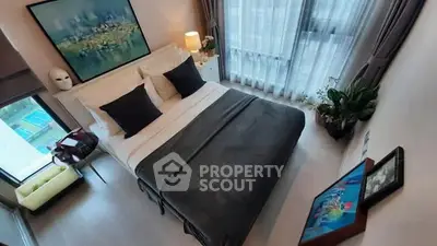 Modern bedroom with stylish decor and large window view