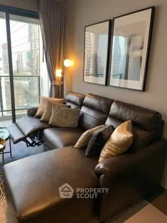 Luxurious living room with leather sectional sofa and modern decor in high-rise apartment.