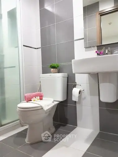 Modern bathroom with sleek gray tiles and stylish fixtures