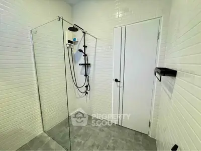 Modern bathroom with glass shower and white subway tiles