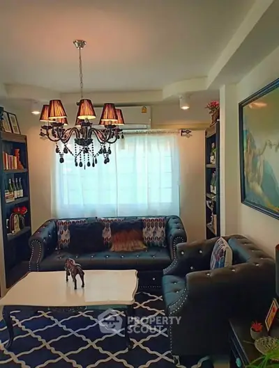 Elegant living room with classic chandelier and stylish furniture