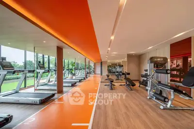 Modern gym with state-of-the-art equipment and scenic outdoor view