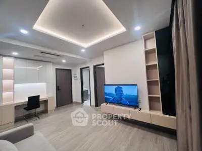 Modern living room with sleek design, built-in shelves, and ambient lighting.