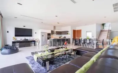 Spacious modern living room with open kitchen and stylish decor