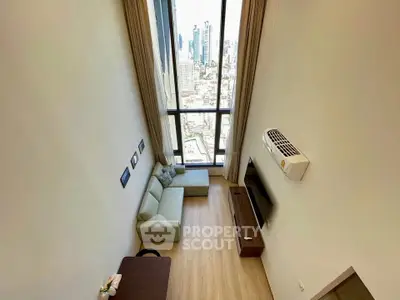 Stunning high-rise living room with floor-to-ceiling windows and breathtaking city view.